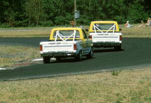 Steve Saleen's and George Follmer's Ford Rangers head through turn 4