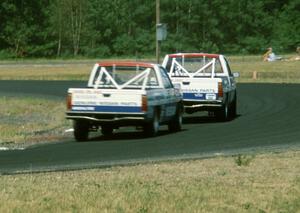 Two of the Nissan Pickups, drivers unknown, possibly Ray Kong and Jeff Krosnoff