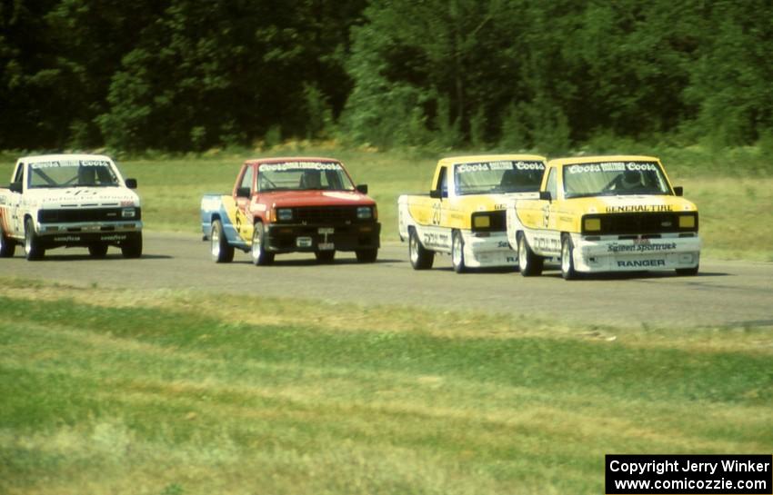 Steve Saleen's and George Follmer's Ford Rangers lead Peter Farrell's Dodge Ram D-50 and Chuck Hemmingson's Jeep Comanche into 4