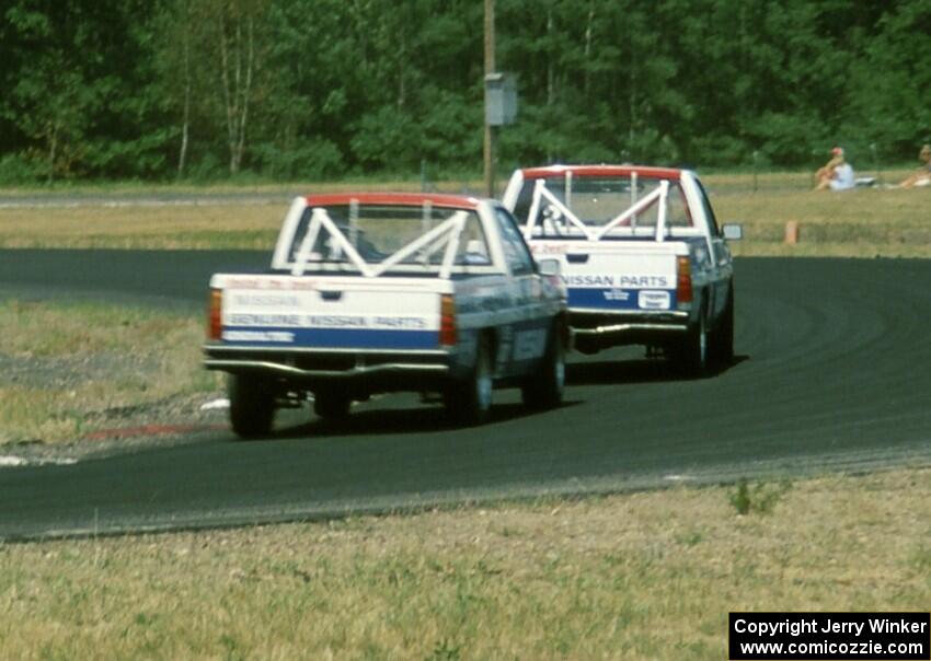 Two of the Nissan Pickups, drivers unknown, possibly Ray Kong and Jeff Krosnoff
