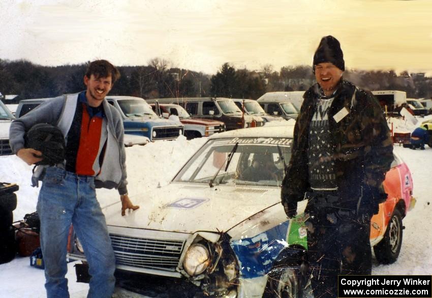 Paul Richardson  and Jerry Winker stand in front of their slightly battered Mazda GLC