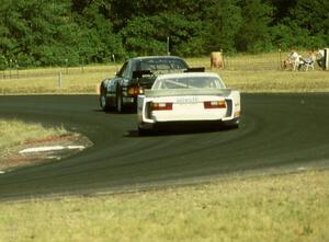 Deborah Gregg's Merkur XR4Ti leads Paul Radisich's Porsche 944 Turbo in morning practice