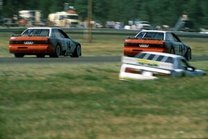 The Group 44 Audi 200 Quattros of (14) Hans Stuck and (44) Hurley Haywood on the cool off lap