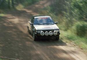 Erik Zenz / Brian Berg push hard to keep ahead of Bruno in their open class Mazda 323GTX.