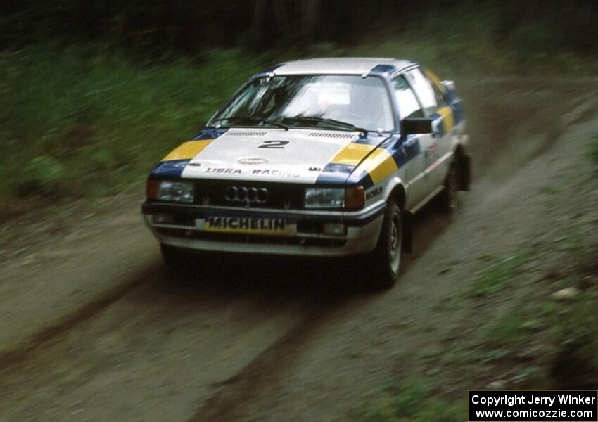 Paul Choiniere / Doug Nerber fly down a straight in the Paul Bunyan forest in their Audi Quattro.