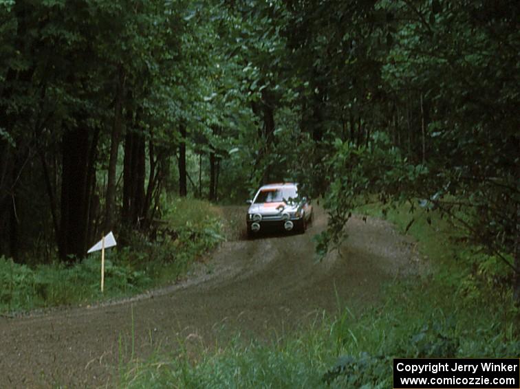 Jeff Zwart / Cal Coatsworth in their Mazda 323GTX prepare for a hairpin.