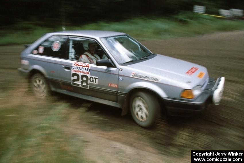 Allan George / Gary Judy fly by in their PGT class Mazda 323GTX running in Group A.