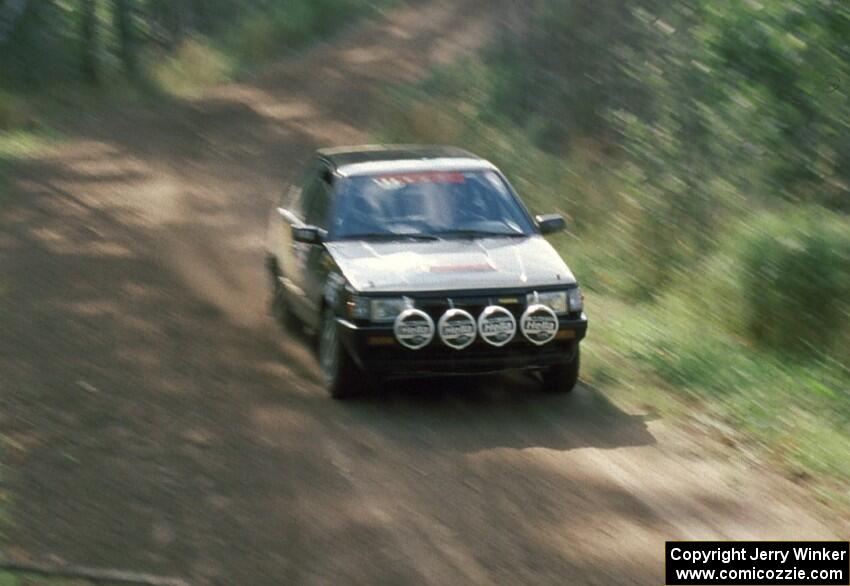 Erik Zenz / Brian Berg push hard to keep ahead of Bruno in their open class Mazda 323GTX.