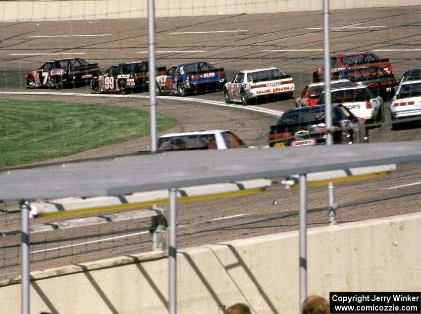 The field streams through turn one.