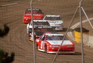 Five cars come out of turn 4