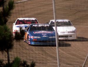 Bob Senneker and Butch Miller put a lap on Cindy Peterson