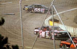 (99) Dick Trickle's Ford Thunderbird and (68) Matt Kenseth's Chevy Lumina tangle between turns 3 and 4