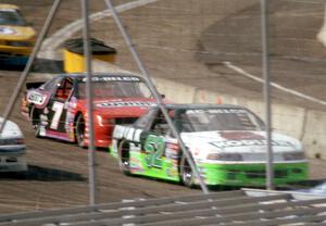 Ken Schrader's Chevy Lumina and Gary St. Amant's Ford Thunderbird come out of corner four