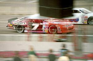 Gary St. Amant's Ford Thunderbird passes Cindy Peterson's Chevy Lumina