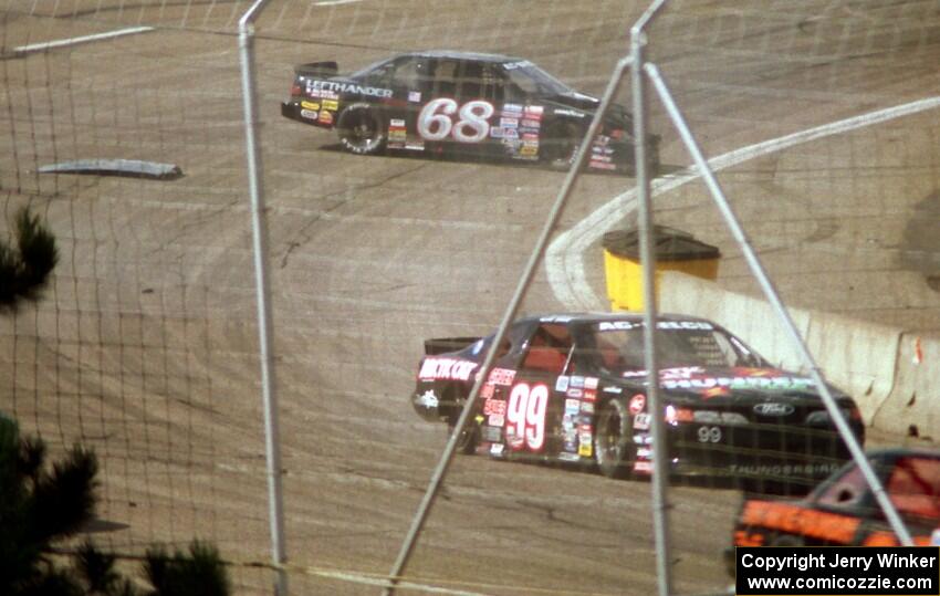 (99) Dick Trickle's Ford Thunderbird and (68) Matt Kenseth's Chevy Lumina tangle between turns 3 and 4