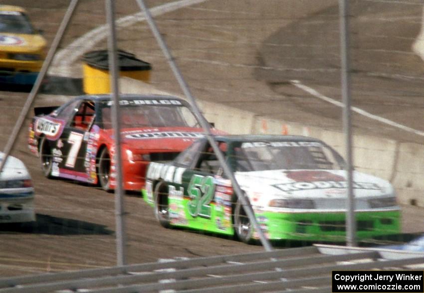 Ken Schrader's Chevy Lumina and Gary St. Amant's Ford Thunderbird come out of corner four