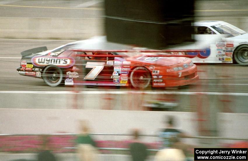 Gary St. Amant's Ford Thunderbird passes Cindy Peterson's Chevy Lumina