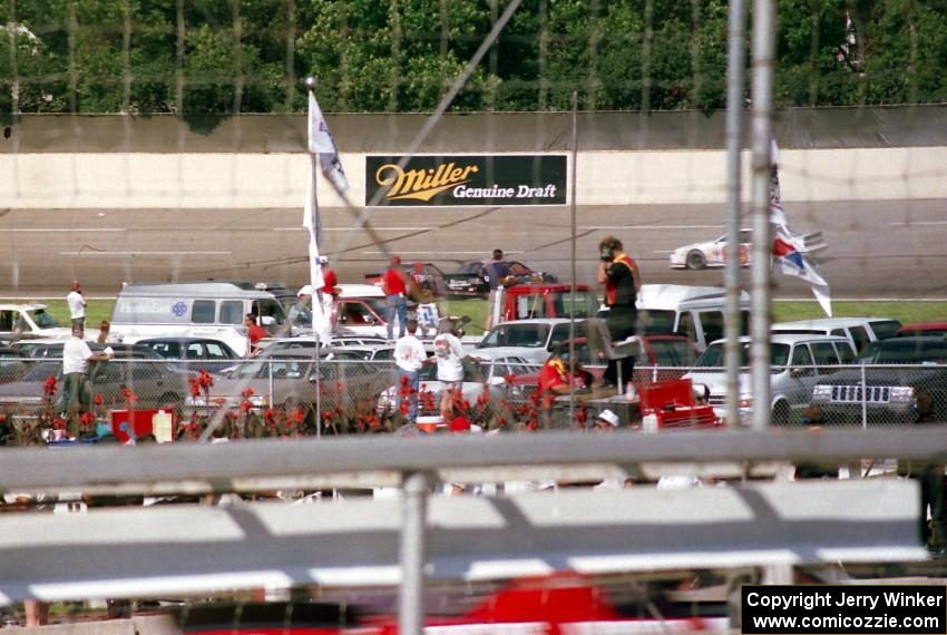 Mike Miller's Chevy Lumina and Mike Eddy's Pontiac Grand Prix tangle in turn 2