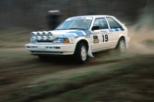 The Mitch McCullough / Doug Dill Mazda 323GTX get the corner right on the first stage.