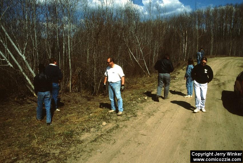 Mark Utecht / Paul Schwerin survey damage after putting their Dodge Omni GLH off the road a mile from the finish of SS6.