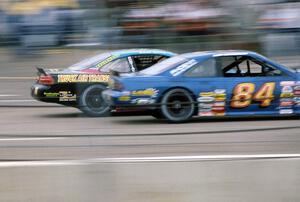 (15) Brandon Sperling's Pontiac Grand Prix inside of (84) Bob Senneker's Ford Thunderbird