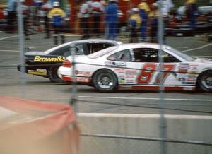 (1) Kevin Cywinski's Chevy Monte Carlo inside of (87) Tony Raines' Pontiac Grand Prix