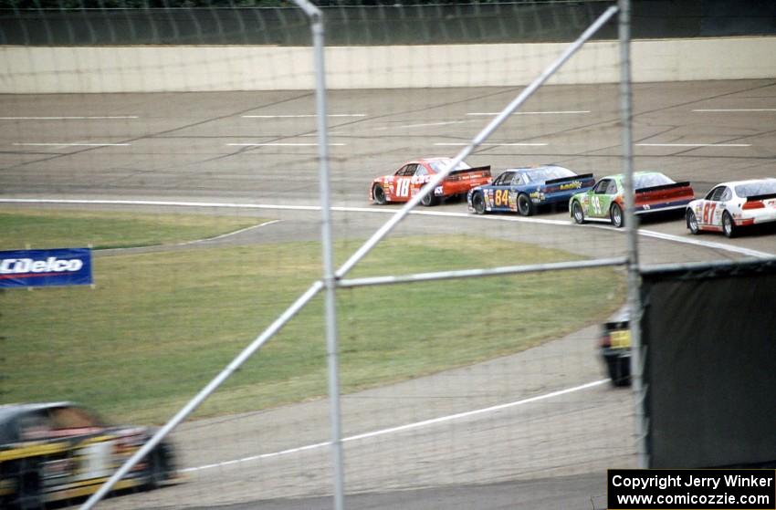 Cars enter turn one early on in the race.