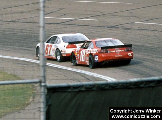 (87) Tony Raines' Pontiac Grand Prix and (18) Mike Miller's Pontiac Grand Prix