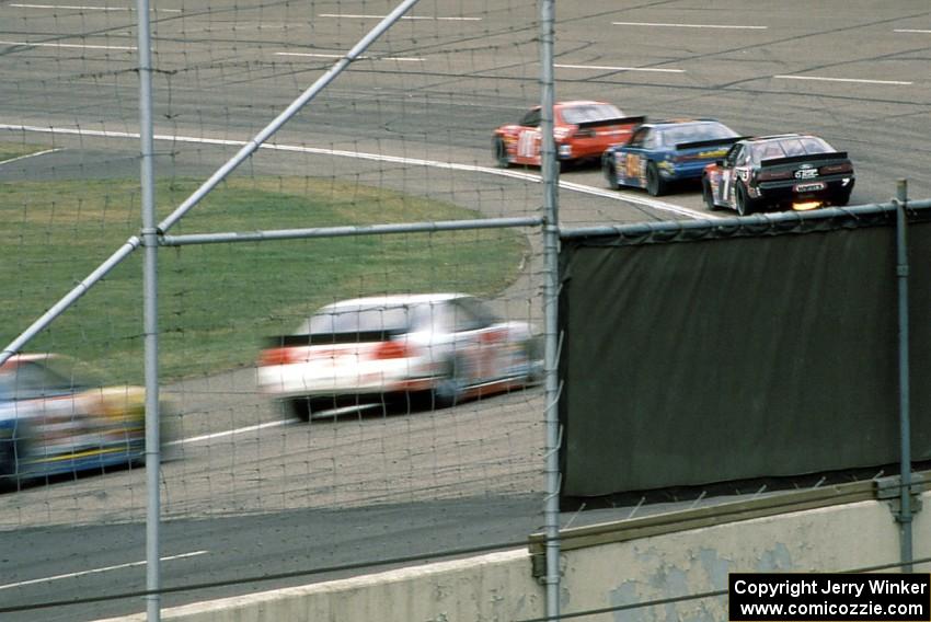 Cars enter turn one