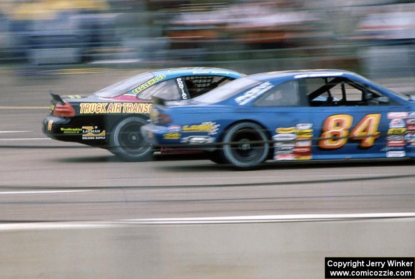 (15) Brandon Sperling's Pontiac Grand Prix inside of (84) Bob Senneker's Ford Thunderbird