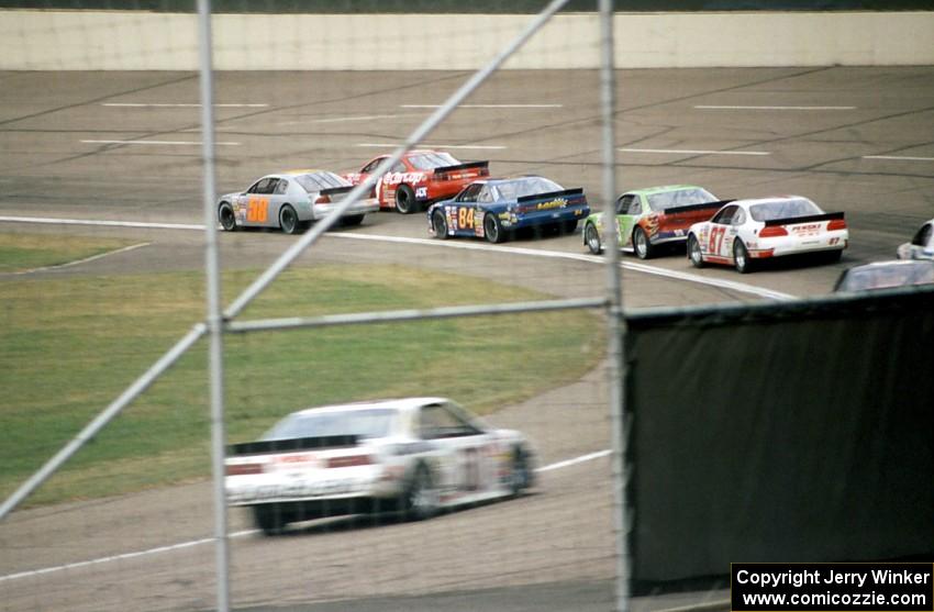 The field streams through turn one