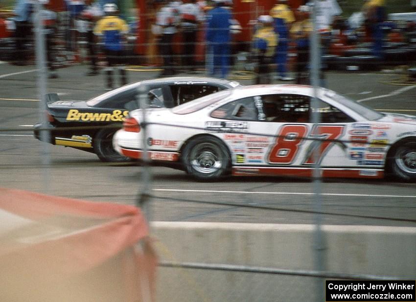 (1) Kevin Cywinski's Chevy Monte Carlo inside of (87) Tony Raines' Pontiac Grand Prix