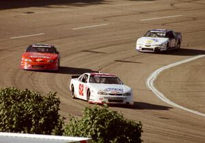 (52) Scott Hansen's Chevy Monte Carlo, (7) Gary St. Amant's Chevy Monte Carlo and (22) ???'s Ford Thunderbird