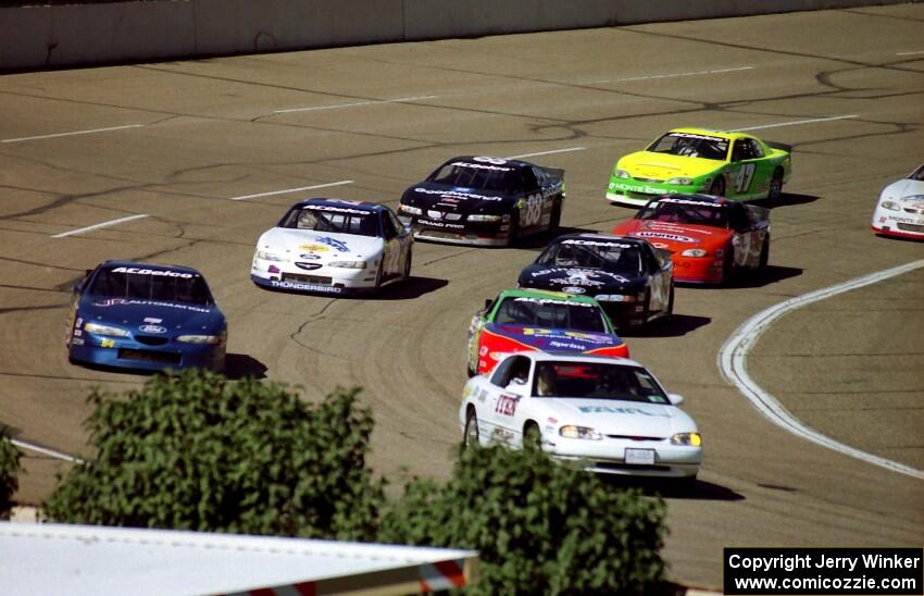 The pace car brings the field around slowly