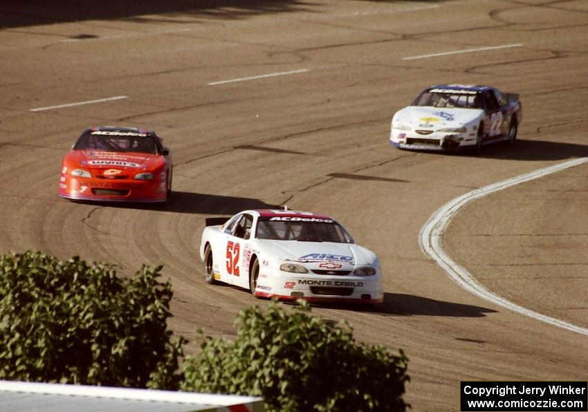 (52) Scott Hansen's Chevy Monte Carlo, (7) Gary St. Amant's Chevy Monte Carlo and (22) ???'s Ford Thunderbird