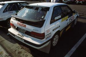 Noel Lawler / Charlie Bradley in their PGT Mazda 323GTX at parc expose.