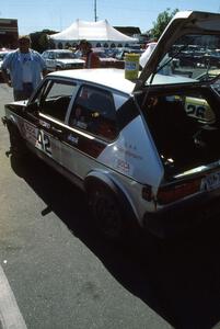 Chris Huntington / Stacy Lukaskawcez do last minute prep to their VW GTI as Norm Johnson watches on.