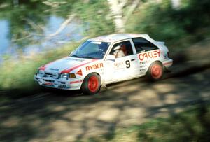 Jeff Zwart / Cal Coatsworth in their Mazda 323GTX blast past one of the many picturesque lakes.