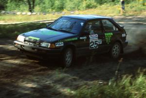 Tom Ottey / Pam McGarvey in their new PGT Mazda 323GTX. They are still rallying this same car today.