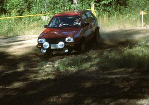 Cal Landau / Eric Marcus in their Dominos sponsored VW GTI hit the haipin perfectly.