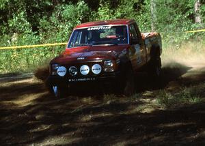 Roger Hull / Rob Cherry motor through the hairpin in their Jeep Comanche.