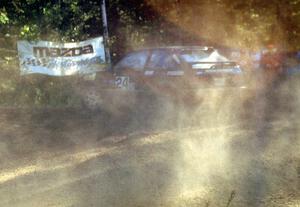 Carl Merrill / J. Jon Wickens spew silt off the wheels of their PGT Mazda 323GTX.