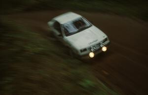 Henry Krolikowski / Cindy Krolikowski at a tight corner on Blue Trail in their Dodge Shadow.