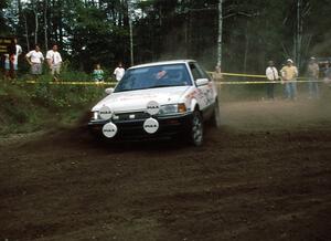 Staurt Sarasin / Joyce Sarasin slide to a halt in their Mazda 323GTX. They recovered to take second in the Paul Bunyan's Ride.