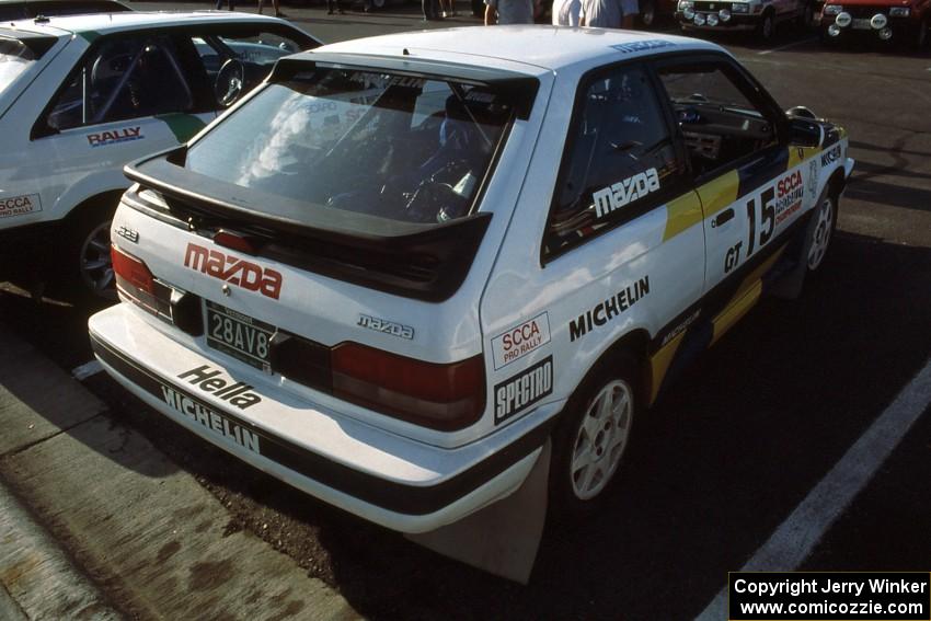 Noel Lawler / Charlie Bradley in their PGT Mazda 323GTX at parc expose.