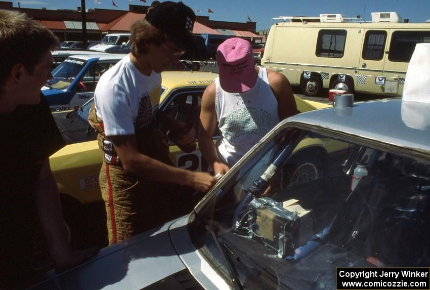 Chris Huntington / Stacy Lukaskawcez do last minute prep to their VW GTI.