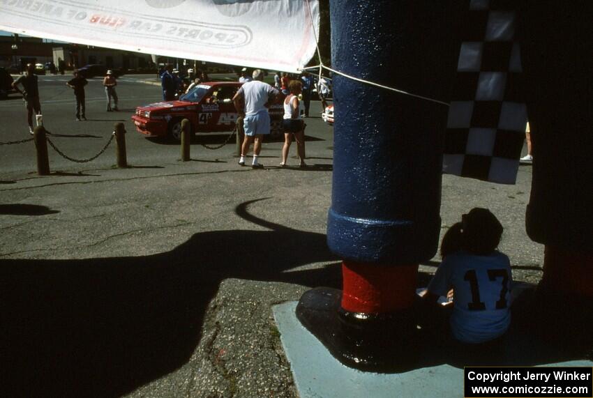 A 9-year old Emily Burton-Weinman watches cars leave the ceremonial start below the Paul Bunyan statue.