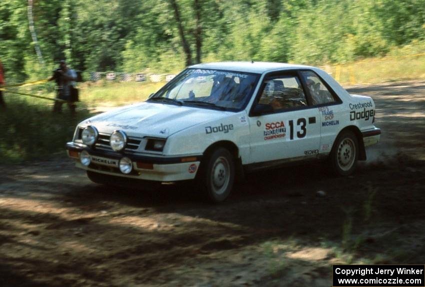 Henry Krolikowski / Cindy Krolikowski get on the gas for the big hill in their Dodge Shadow.