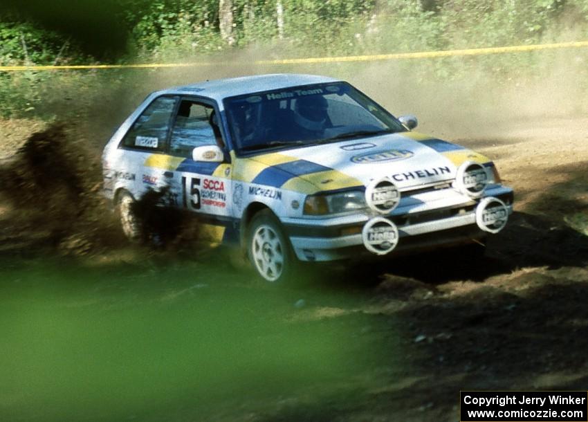 Noel Lawler / Charlie Bradley in their PGT Mazda 323GTX get on the throttle.