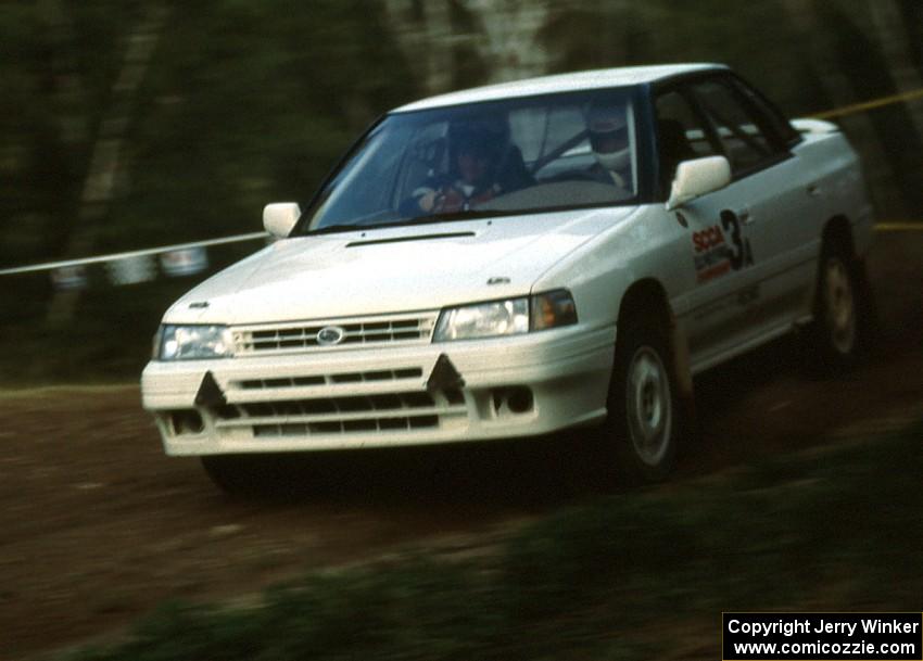 The new factory Subaru Legacy of Chad DiMarco / Erick Hauge comes through the crossroads from Parkway north to Steamboat west.